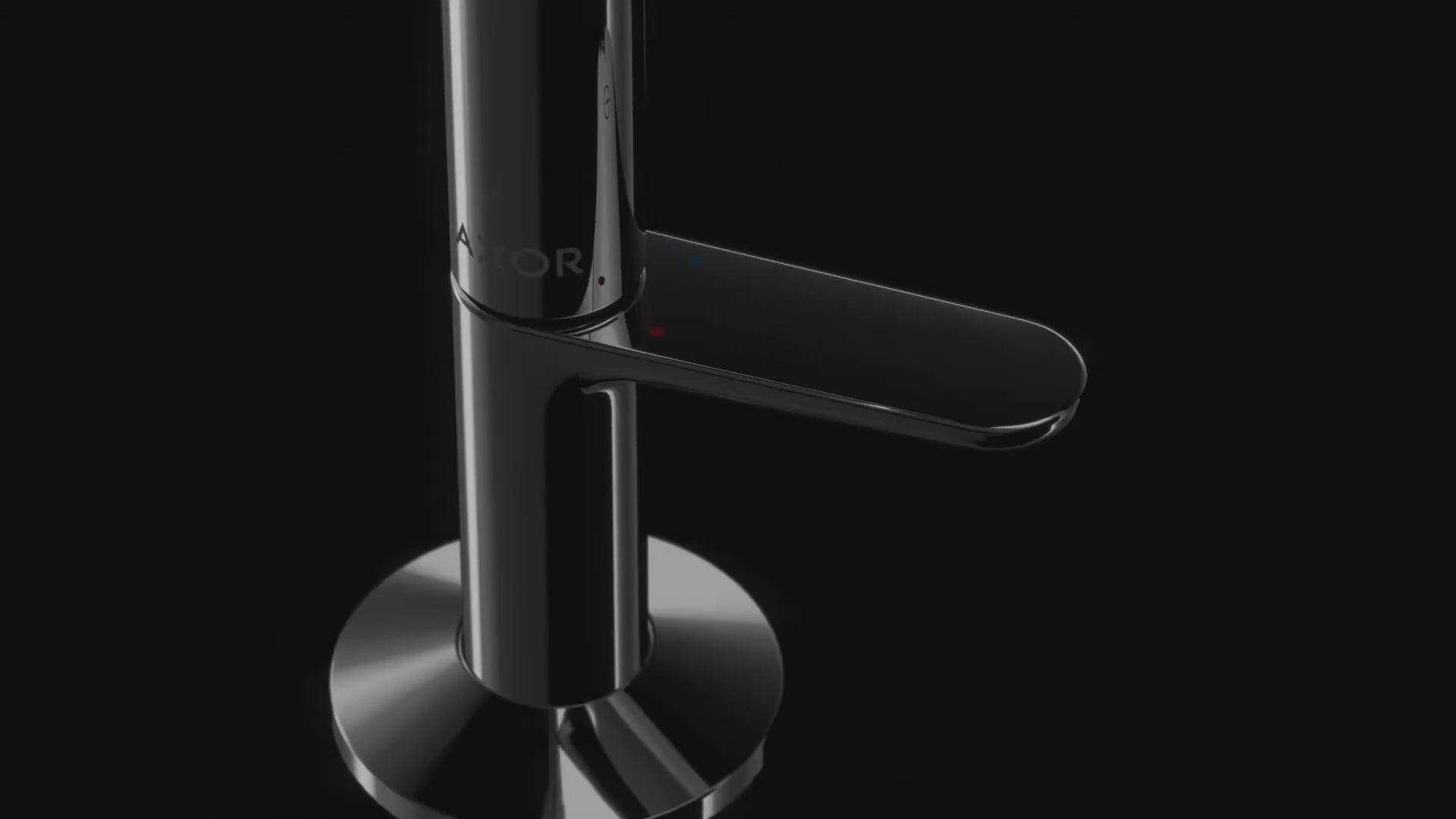 Sweeping video of the push button action on the AXOR One Basin Mixer Faucet in Polished Black Chrome finish, against a black background.